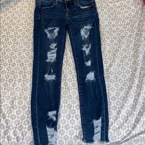 Dark blue ripped jeans
